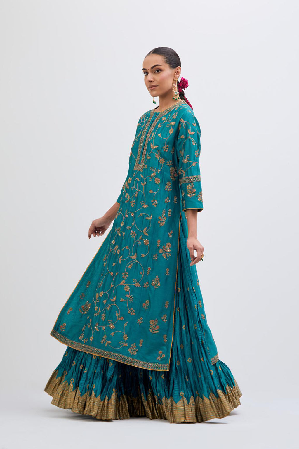 Teal Silk Chanderi kurta set with all-over dull gold dori jaal embroidery and small floral booti at side panels.