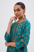 Teal Silk Chanderi kurta set with all-over dull gold dori jaal embroidery and small floral booti at side panels.