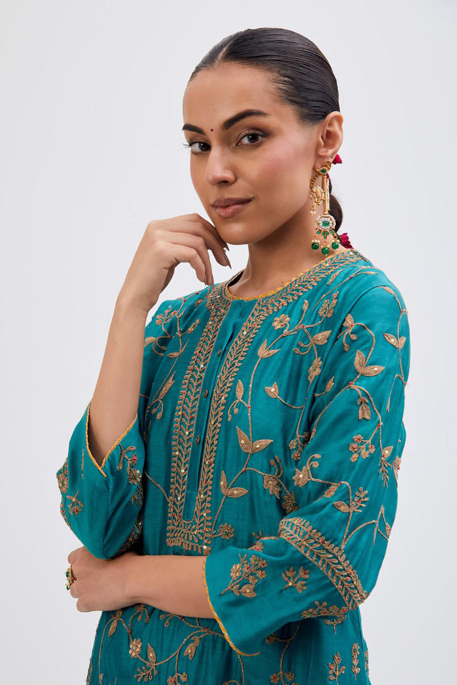 Teal Silk Chanderi kurta set with all-over dull gold dori jaal embroidery and small floral booti at side panels.