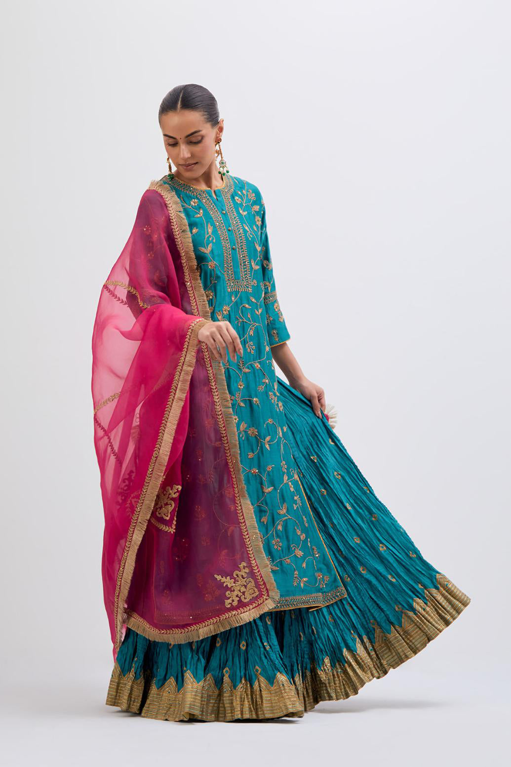Teal Silk Chanderi kurta set with all-over dull gold dori jaal embroidery and small floral booti at side panels.