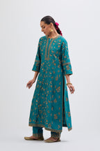 Teal Silk Chanderi kurta set with all-over dull gold dori jaal embroidery and small floral booti at side panels.