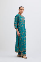 Teal Silk Chanderi kurta set with all-over dull gold dori jaal embroidery and small floral booti at side panels.