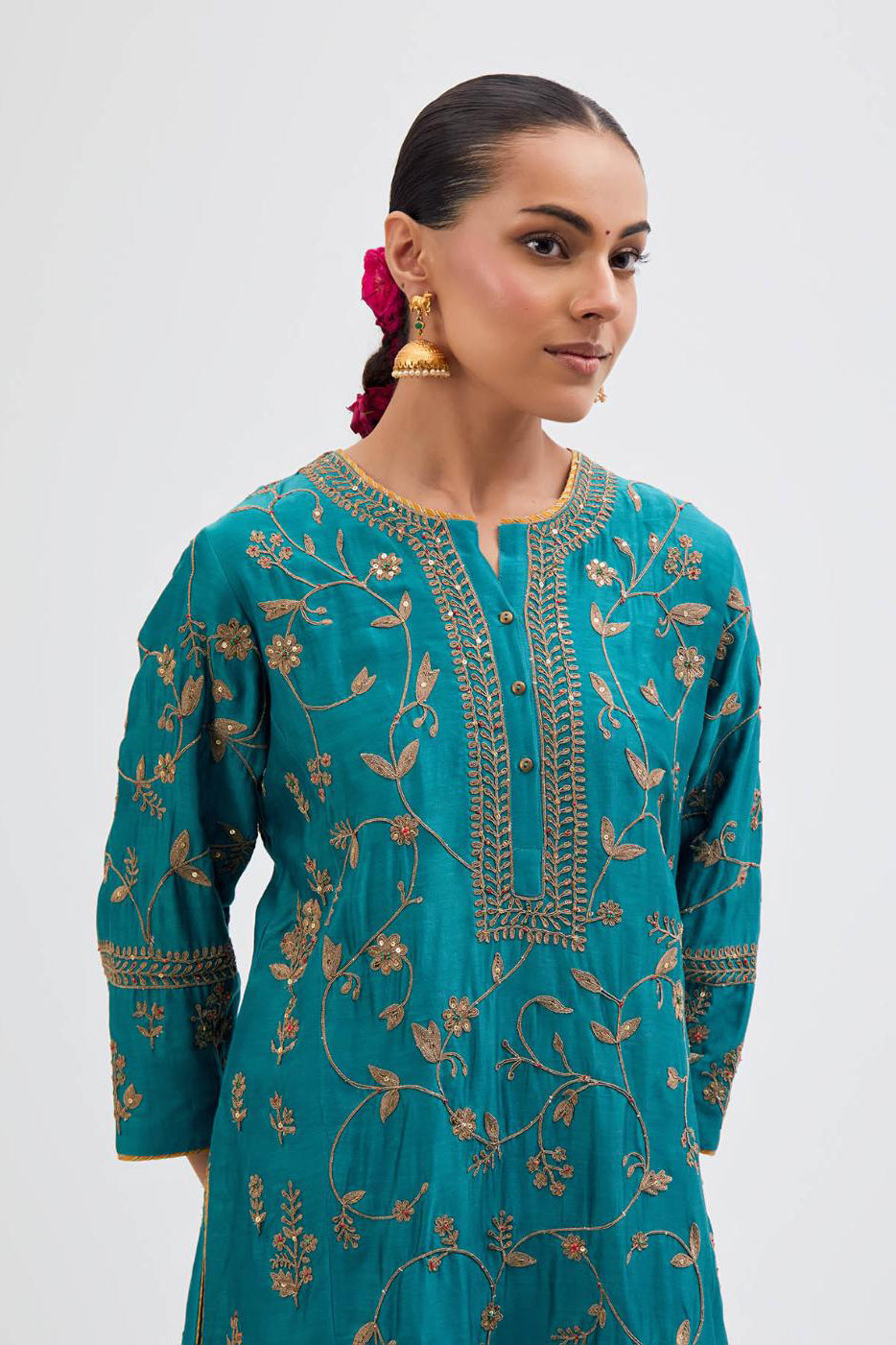 Teal Silk Chanderi kurta set with all-over dull gold dori jaal embroidery and small floral booti at side panels.