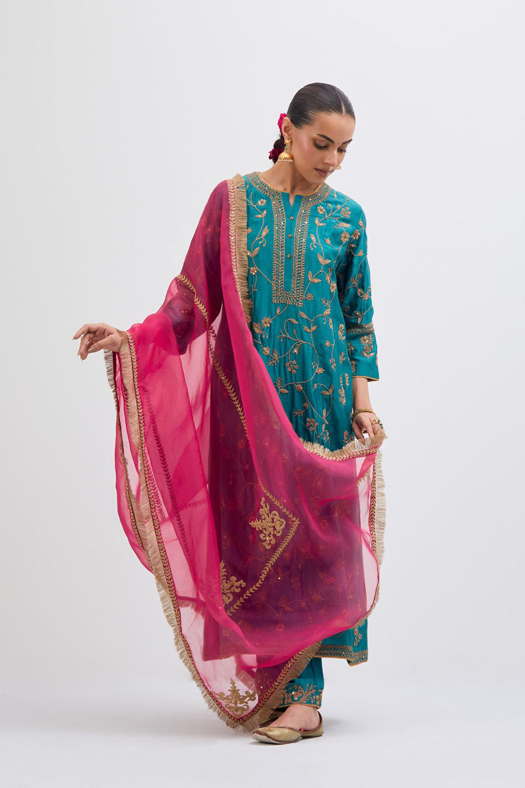 Teal Silk Chanderi kurta set with all-over dull gold dori jaal embroidery and small floral booti at side panels.