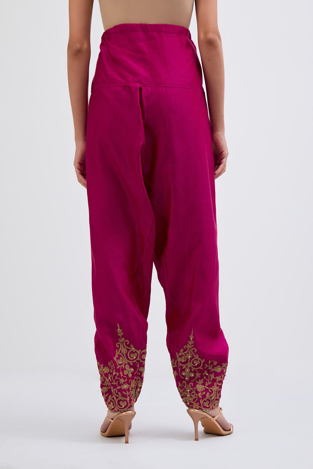 Deep Fuchsia Silk Chanderi narrow salwar with light gold dori embroidery at hem, highlighted with multi colored beads and gold sequins work.