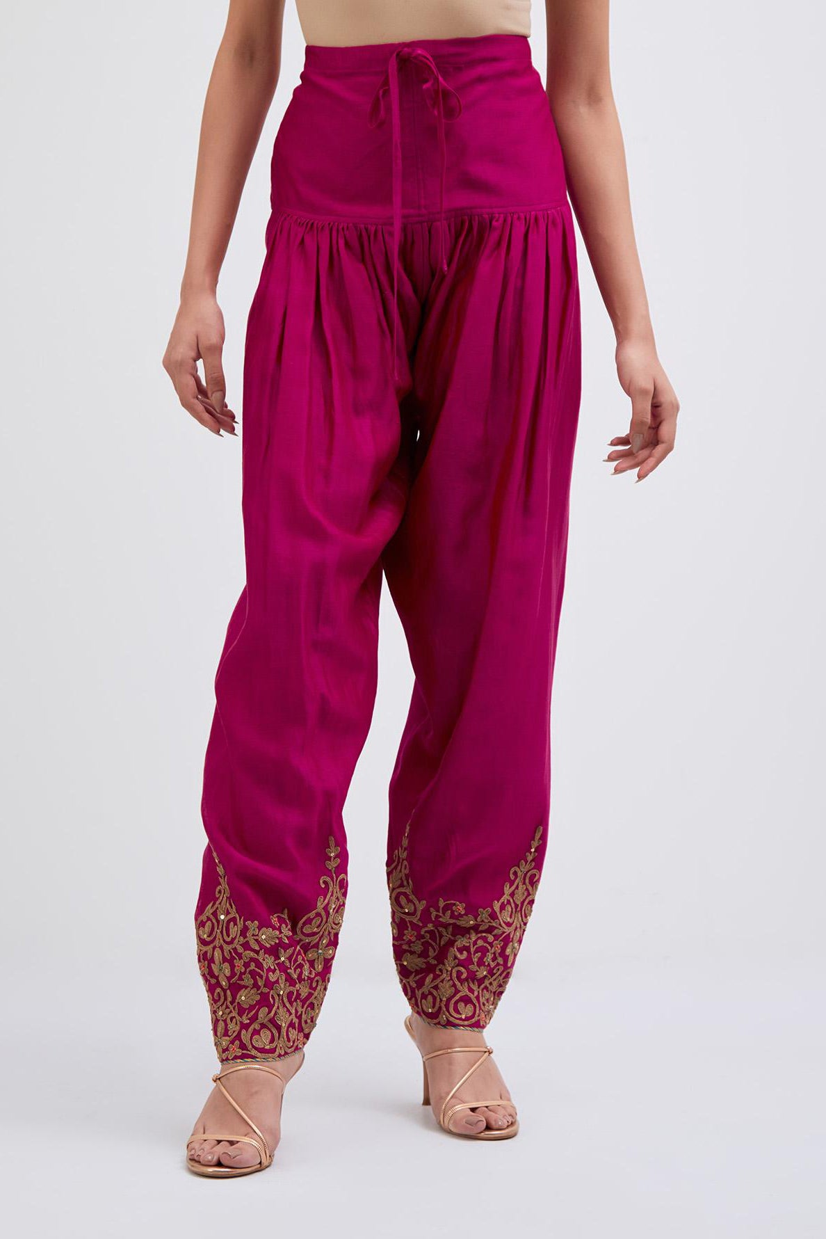 Deep Fuchsia Silk Chanderi narrow salwar with light gold dori embroidery at hem, highlighted with multi colored beads and gold sequins work.