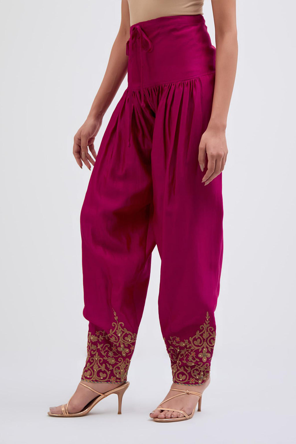 Deep Fuchsia Silk Chanderi narrow salwar with light gold dori embroidery at hem, highlighted with multi colored beads and gold sequins work.