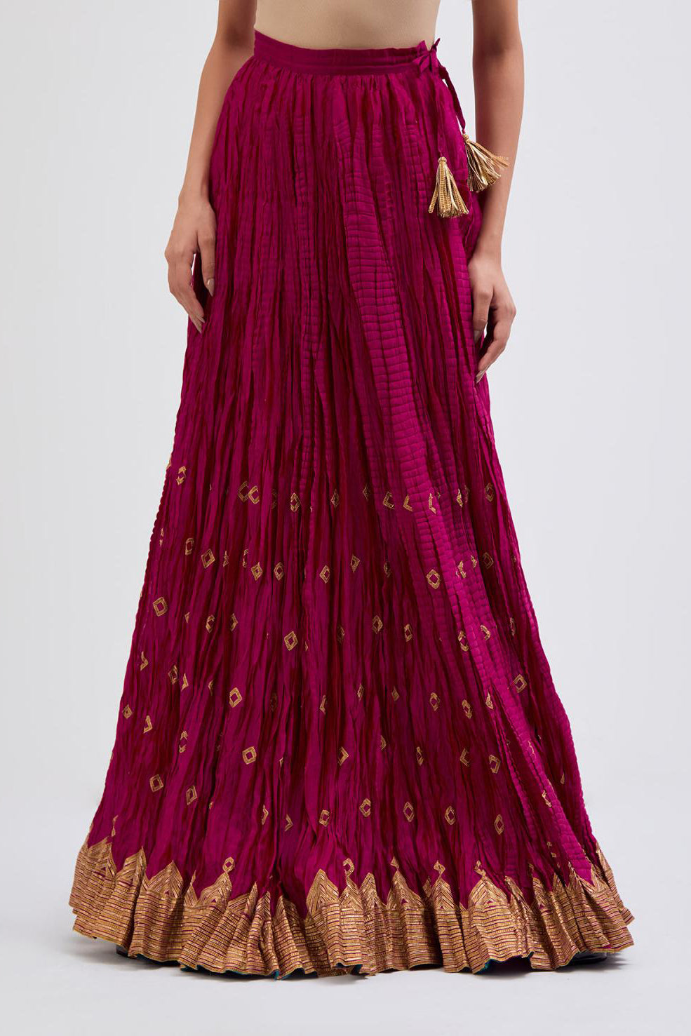 Chanderi 40 kali lehenga edged with dull gold gota embroidery and contrast chanderi facings.