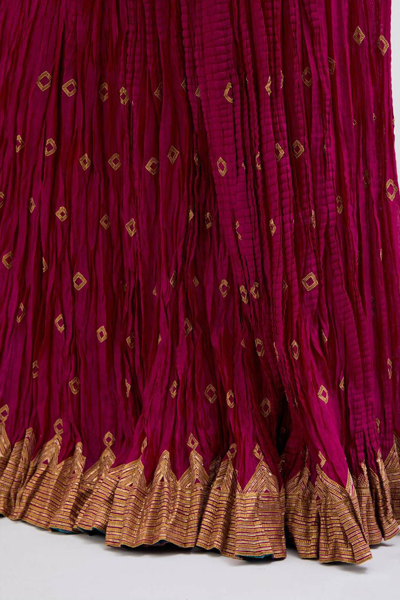 Chanderi 40 kali lehenga edged with dull gold gota embroidery and contrast chanderi facings.