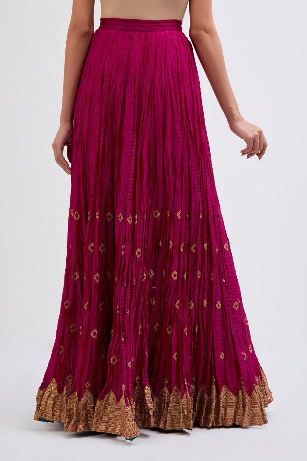 Chanderi 40 kali lehenga edged with dull gold gota embroidery and contrast chanderi facings.