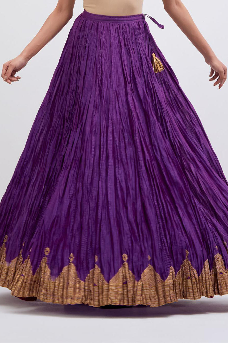 Chanderi 40 kali lehenga edged with dull gold gota embroidery and contrast chanderi facings.
