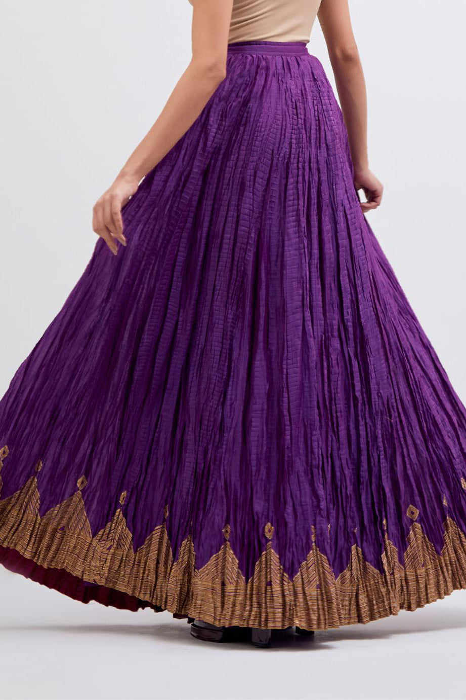 Chanderi 40 kali lehenga edged with dull gold gota embroidery and contrast chanderi facings.