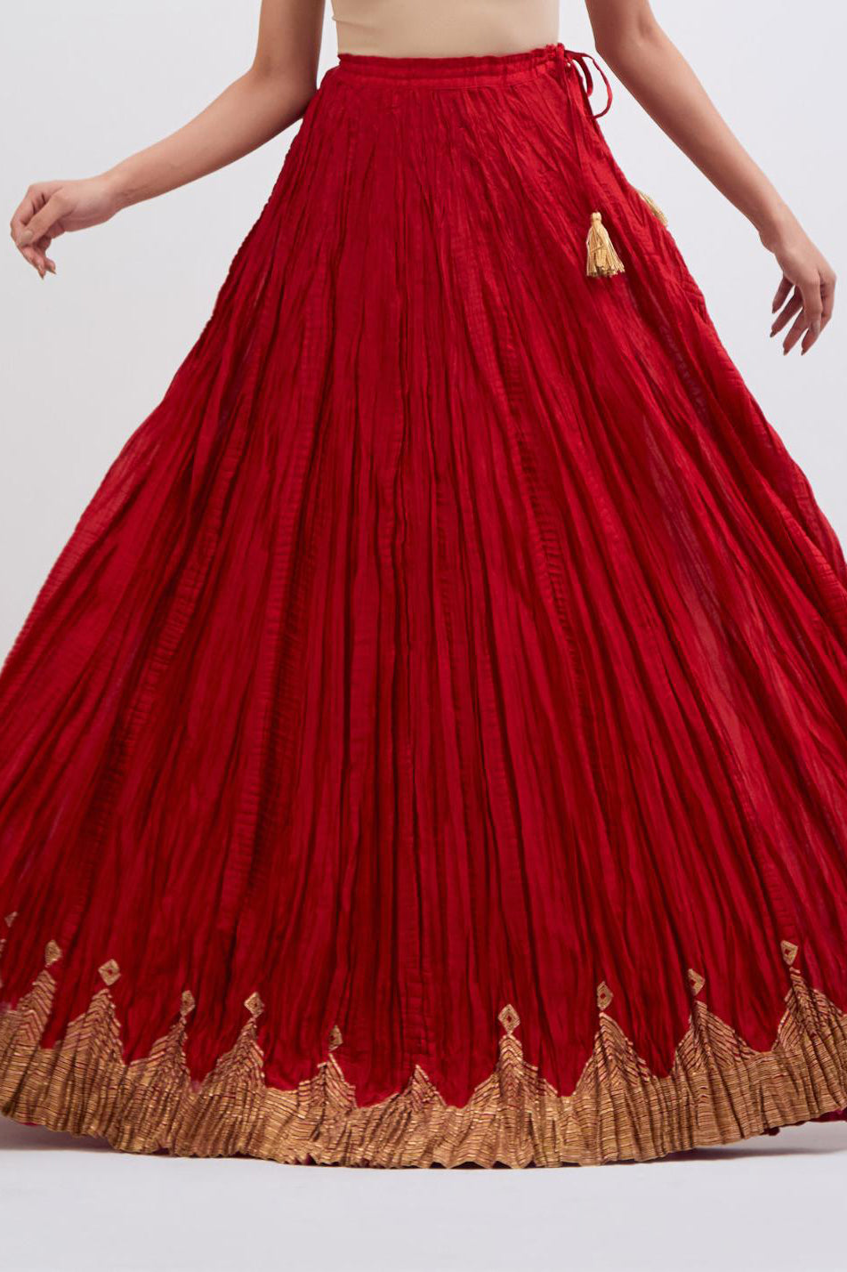 Chanderi 40 kali lehenga edged with dull gold gota embroidery and contrast chanderi facings.