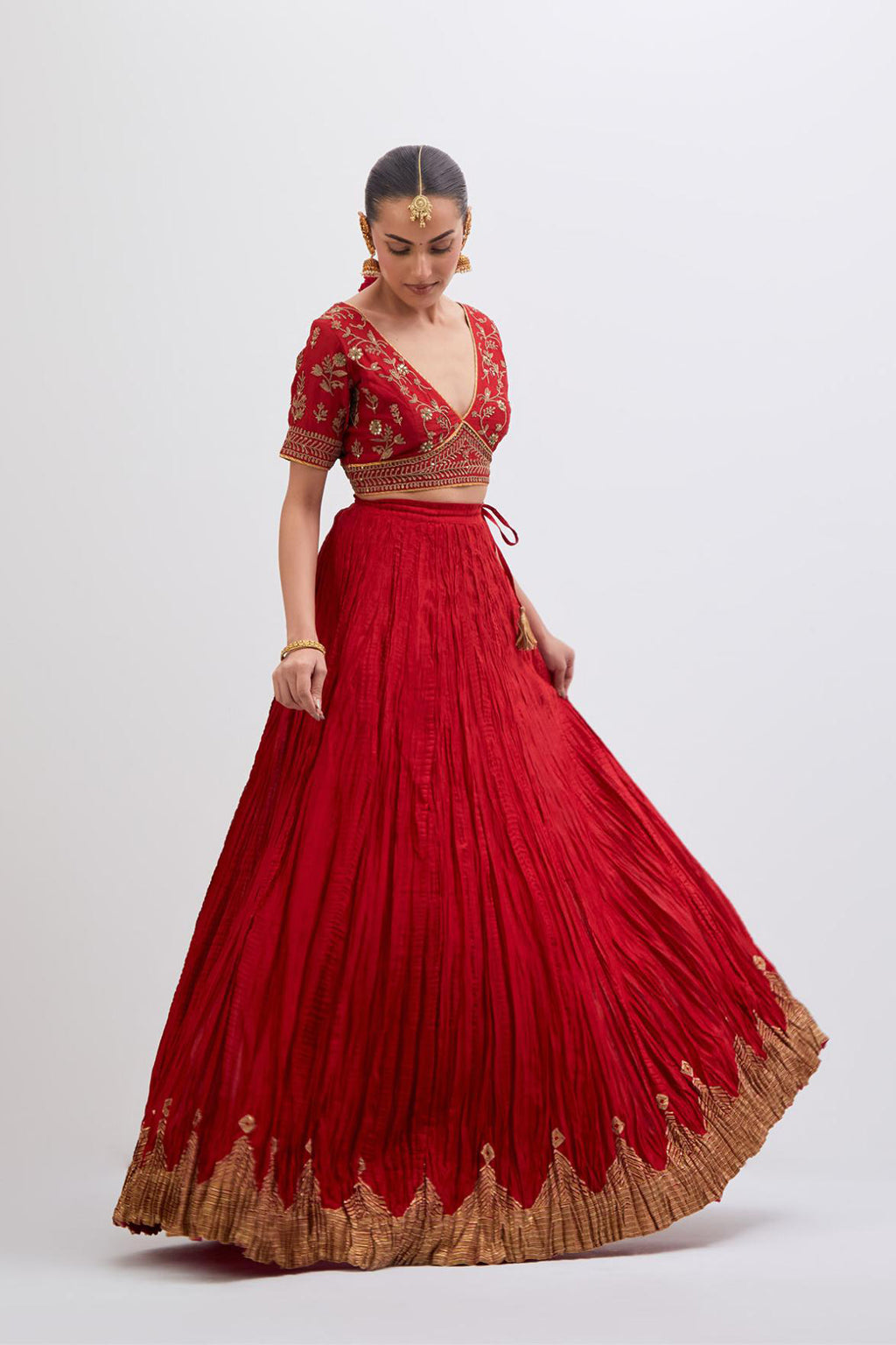 Bright Red Silk Chanderi choli set with all-over dull gold dori embroidery, highlighted with multi colored beads and gold sequins work.