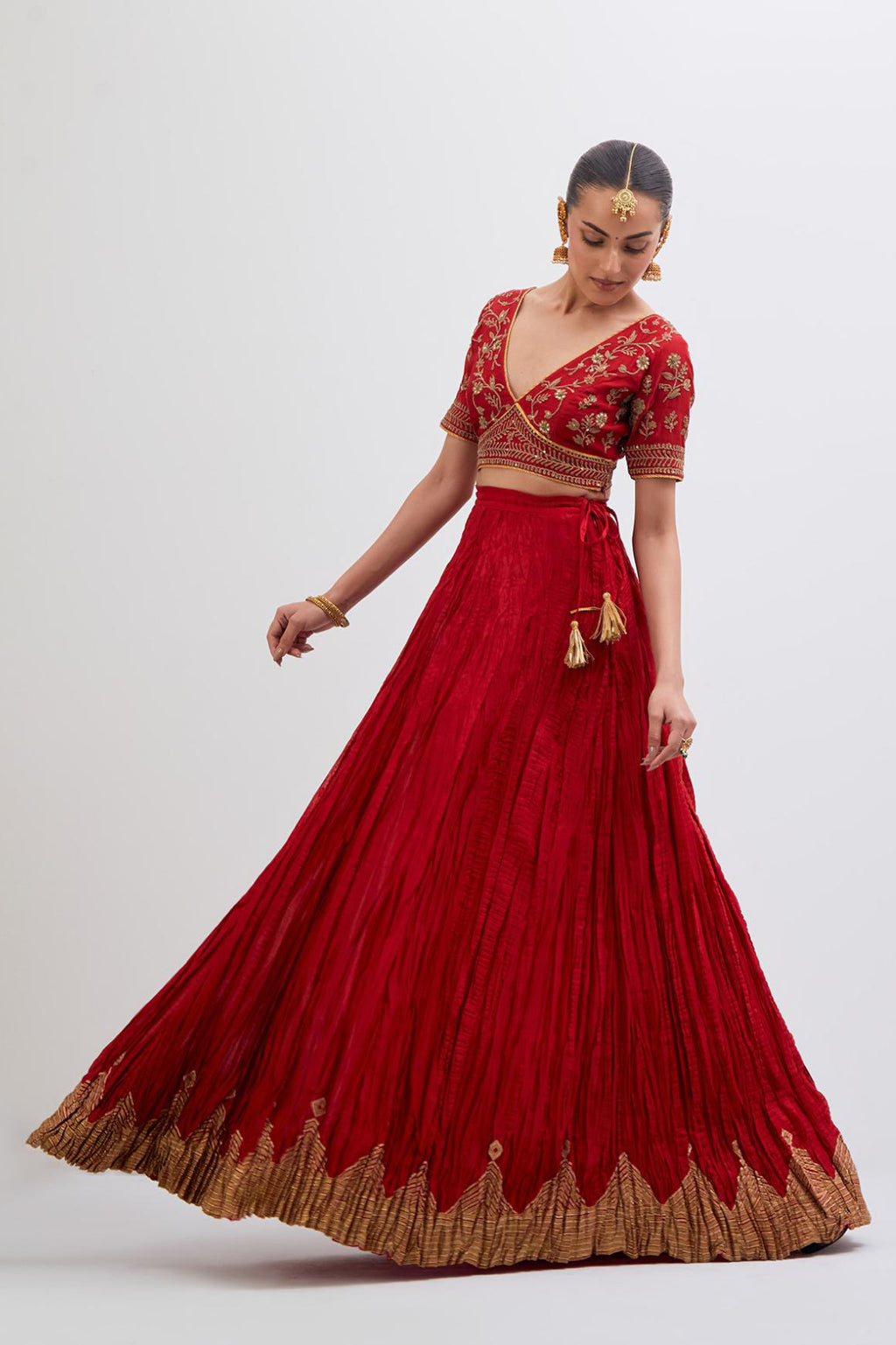 Bright Red Silk Chanderi choli set with all-over dull gold dori embroidery, highlighted with multi colored beads and gold sequins work.