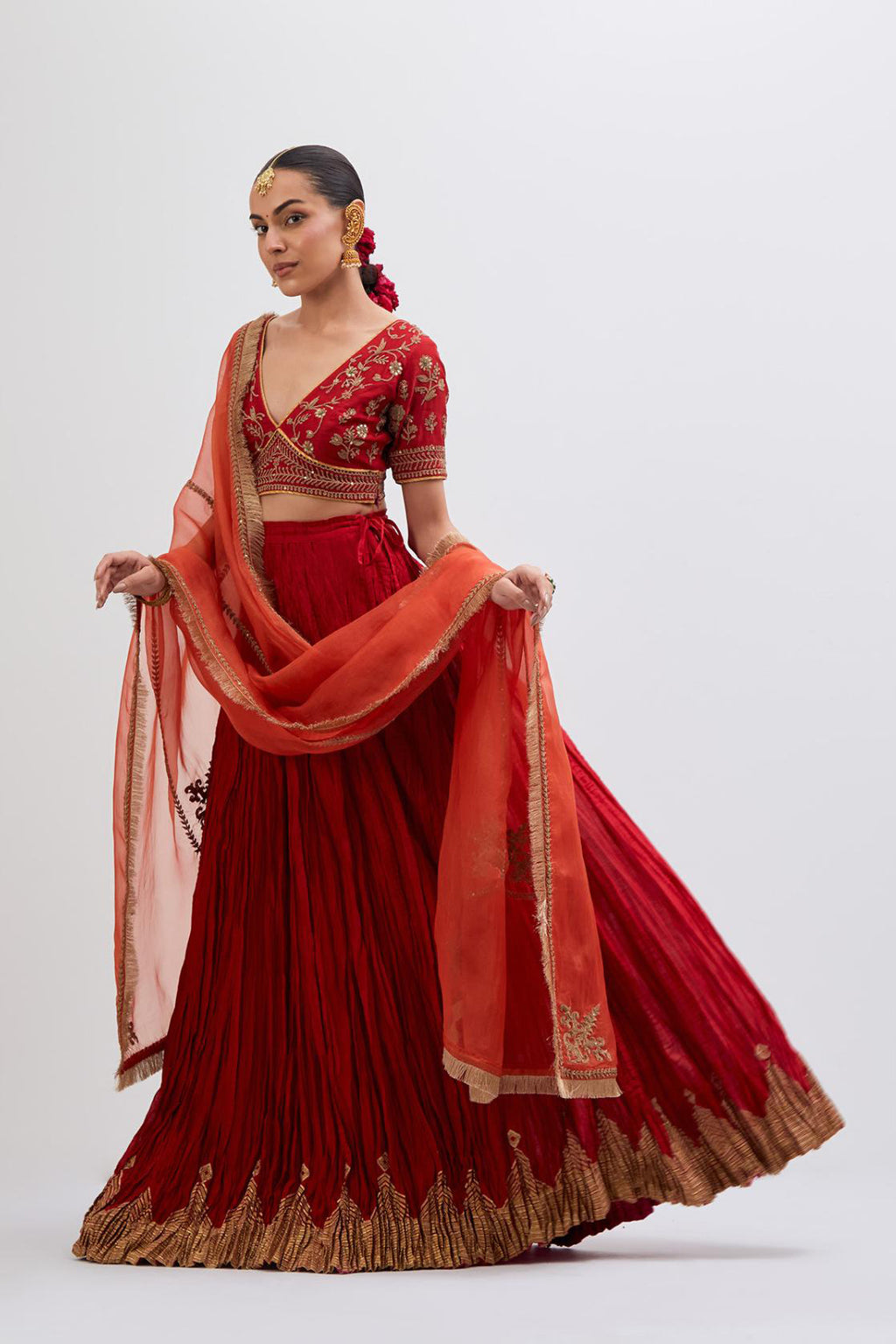 Bright Red Silk Chanderi choli set with all-over dull gold dori embroidery, highlighted with multi colored beads and gold sequins work.