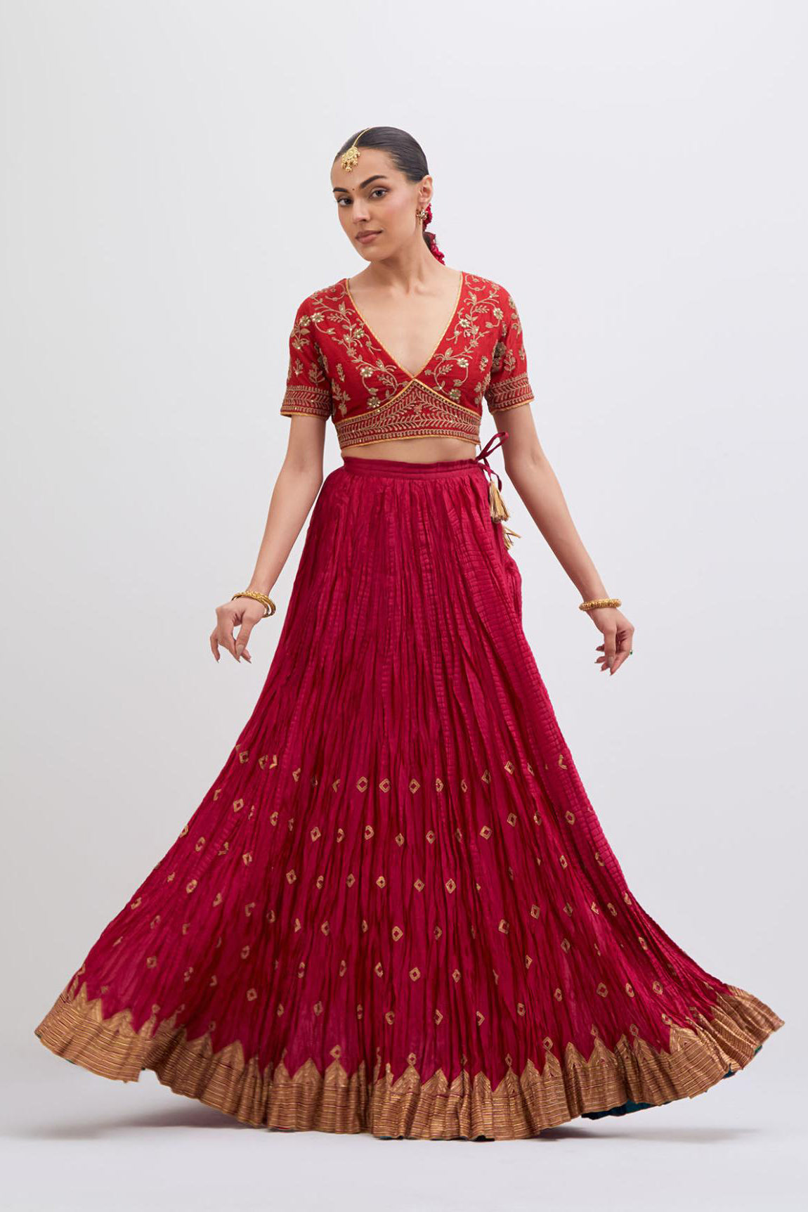 Bright Red Silk Chanderi choli set with all-over dull gold dori embroidery, highlighted with multi colored beads and gold sequins work.