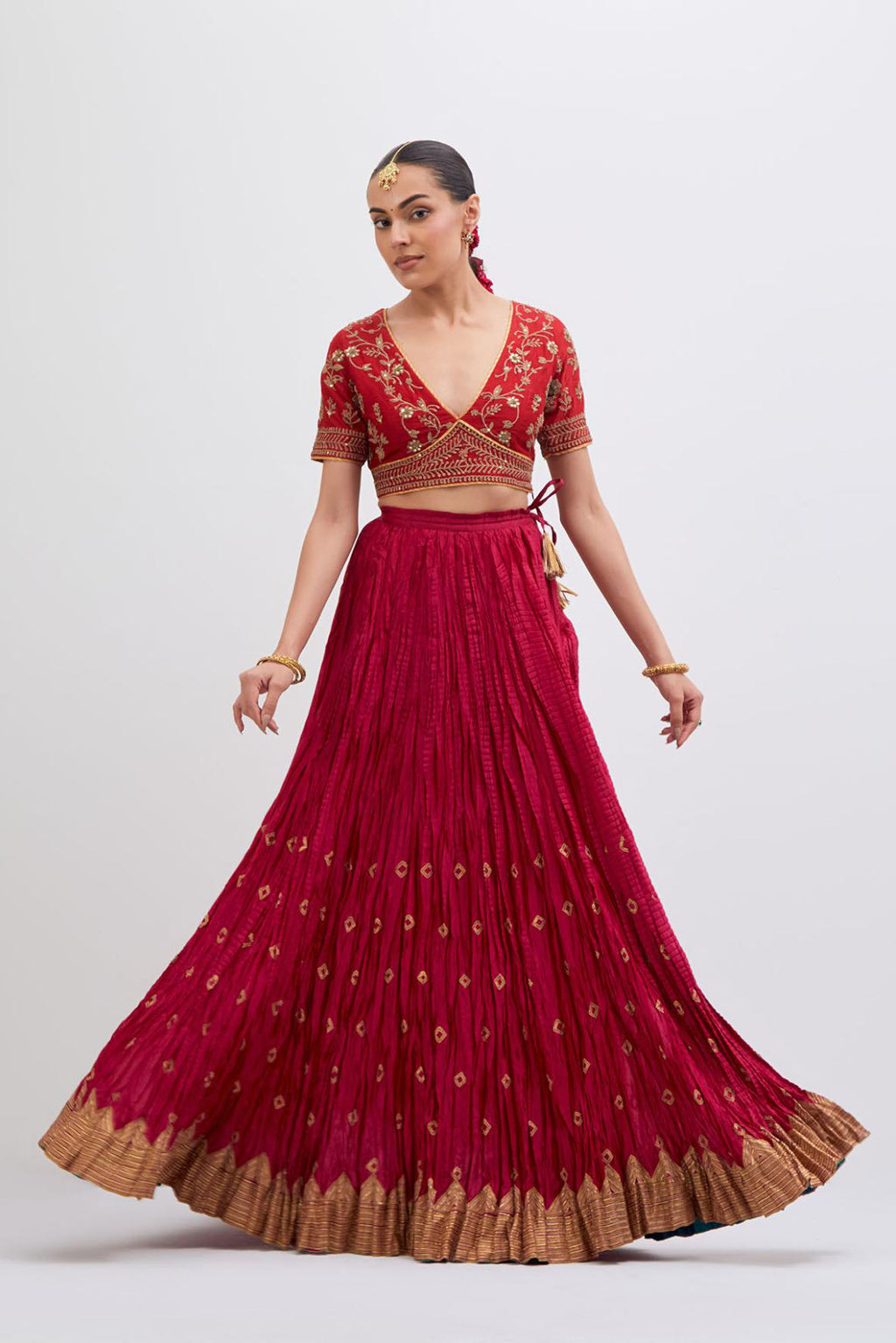 Bright Red Silk Chanderi choli set with all-over dull gold dori embroidery, highlighted with multi colored beads and gold sequins work.