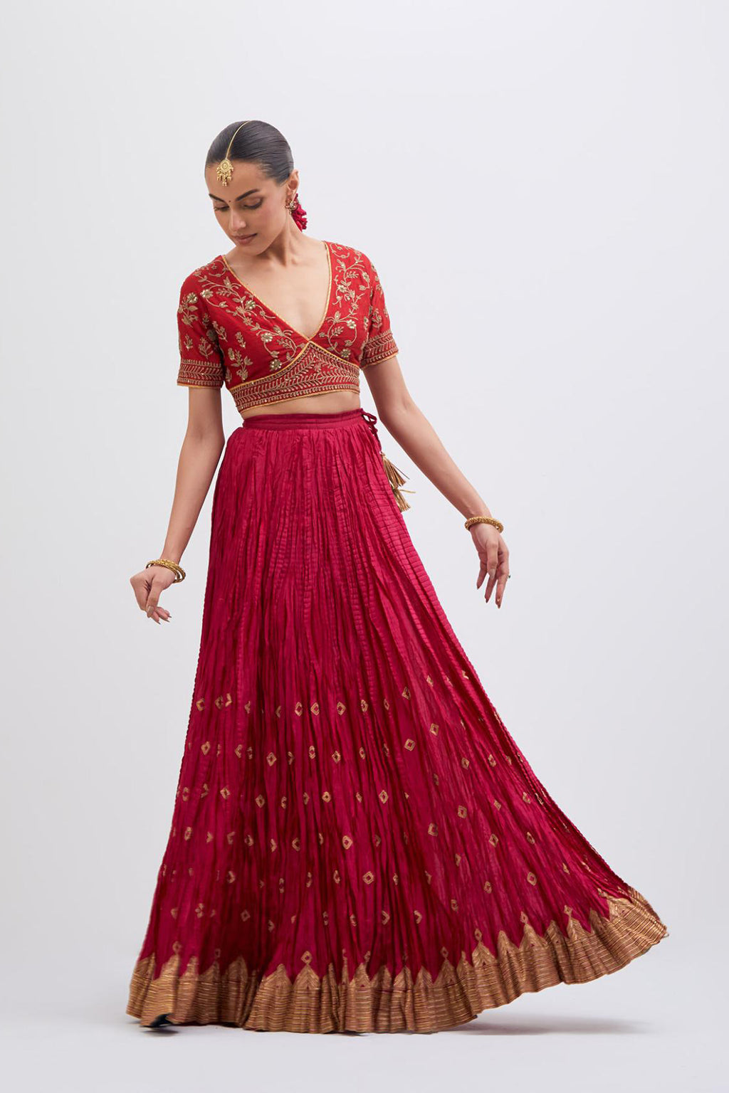Bright Red Silk Chanderi choli set with all-over dull gold dori embroidery, highlighted with multi colored beads and gold sequins work.