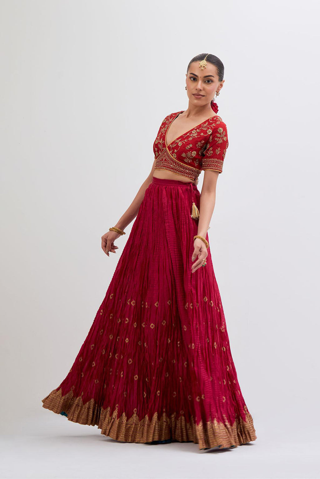 Bright Red Silk Chanderi choli set with all-over dull gold dori embroidery, highlighted with multi colored beads and gold sequins work.