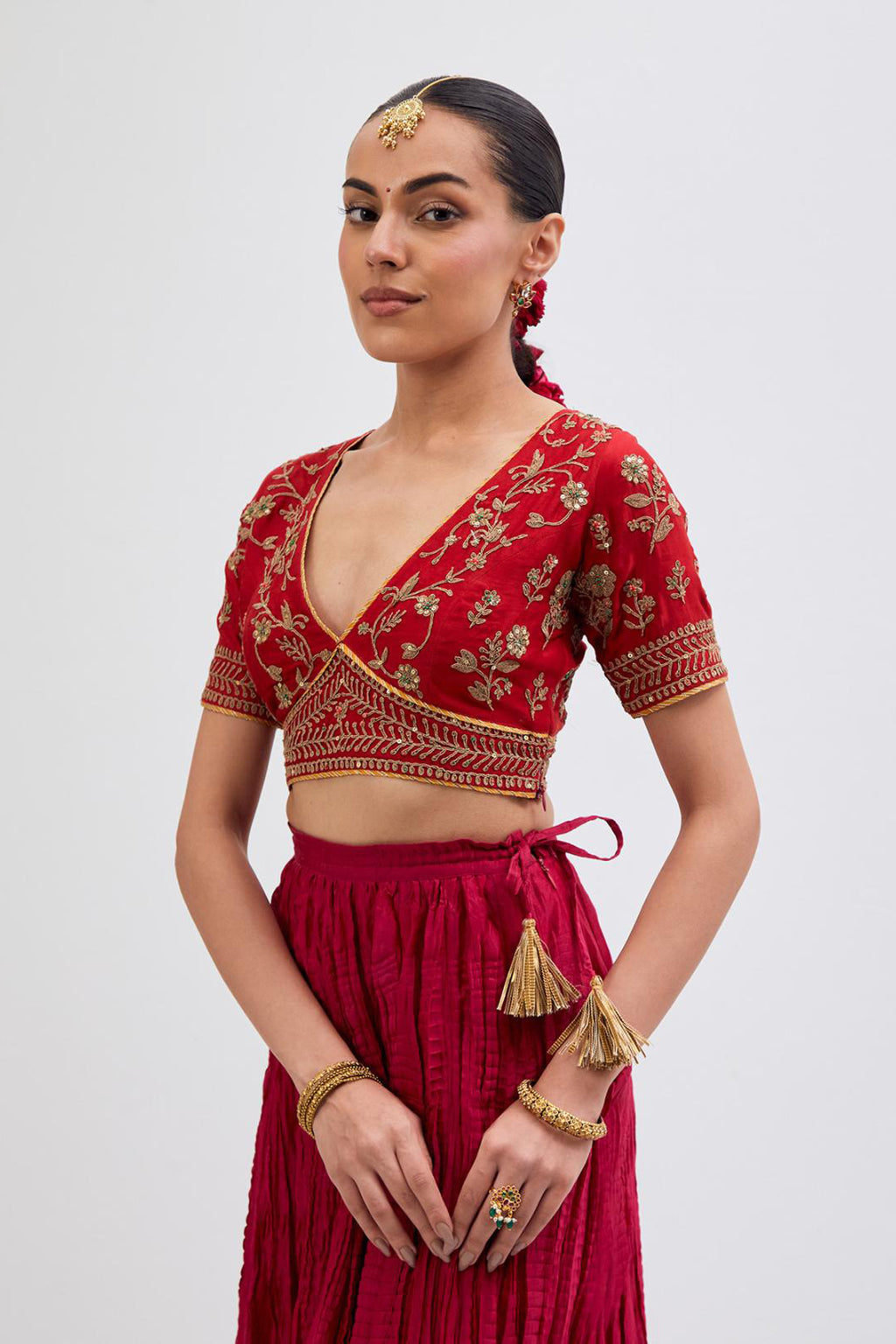 Bright Red Silk Chanderi choli set with all-over dull gold dori embroidery, highlighted with multi colored beads and gold sequins work.