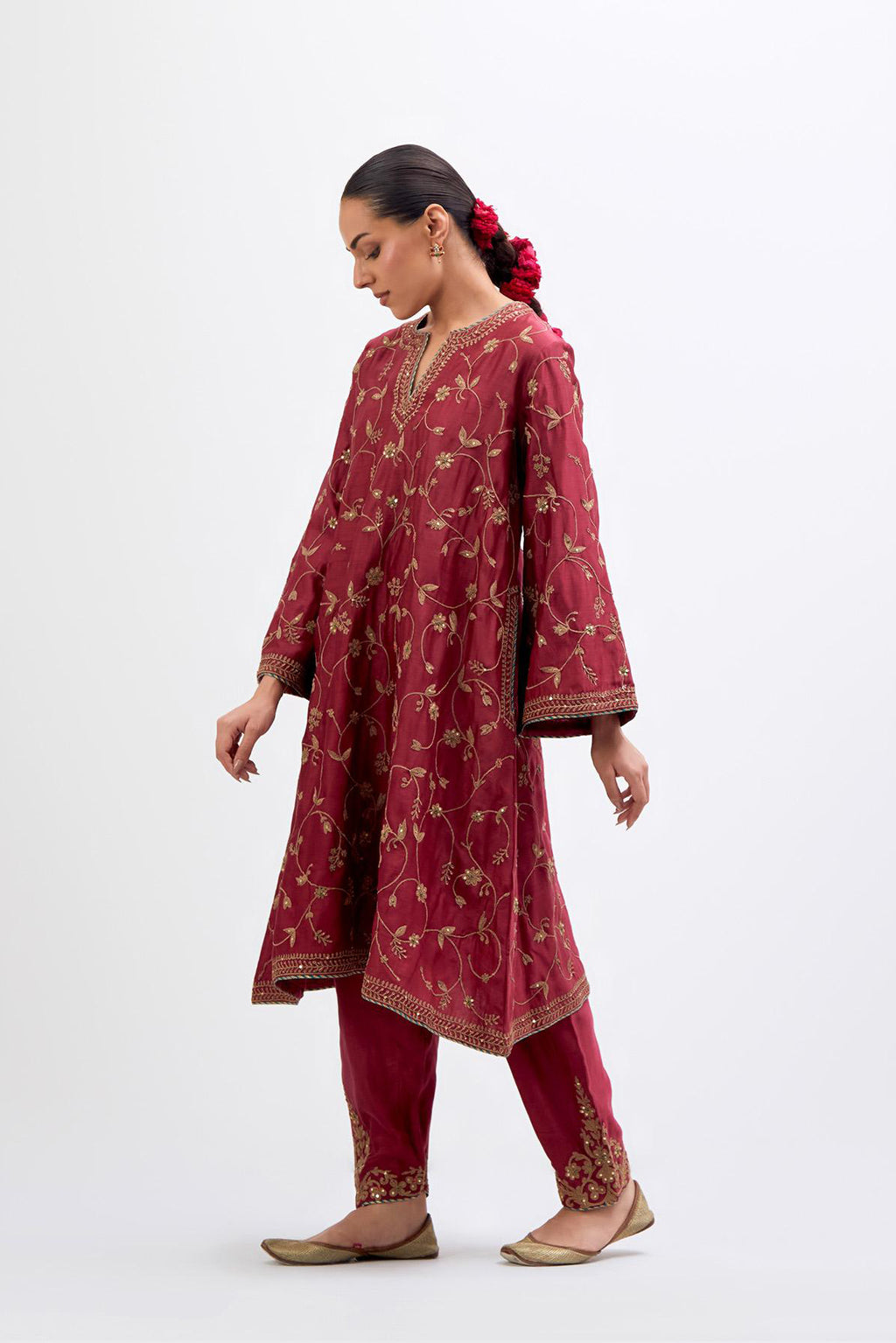 Red Silk Chanderi A-line short kurta set with all-over dull gold dori embroidery, highlighted with multi colored bead and gold sequins work.