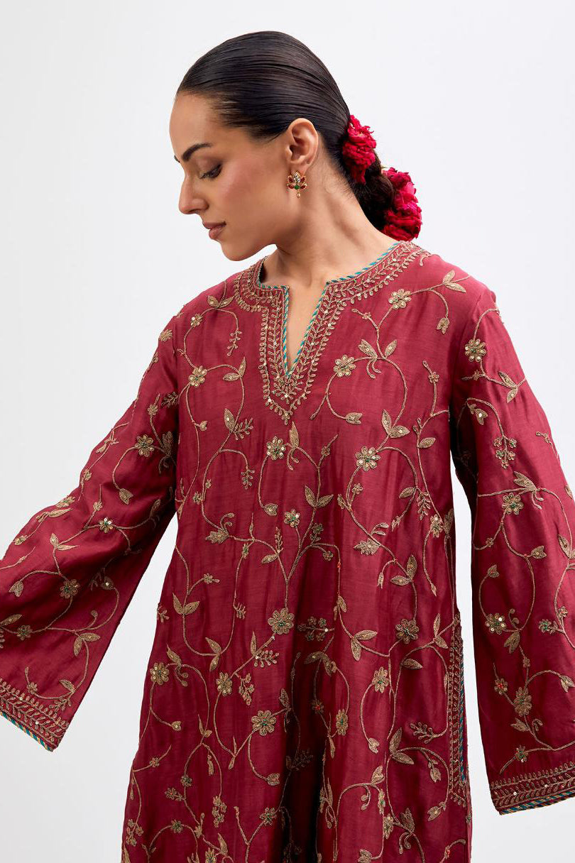 Red Silk Chanderi A-line short kurta set with all-over dull gold dori embroidery, highlighted with multi colored bead and gold sequins work.