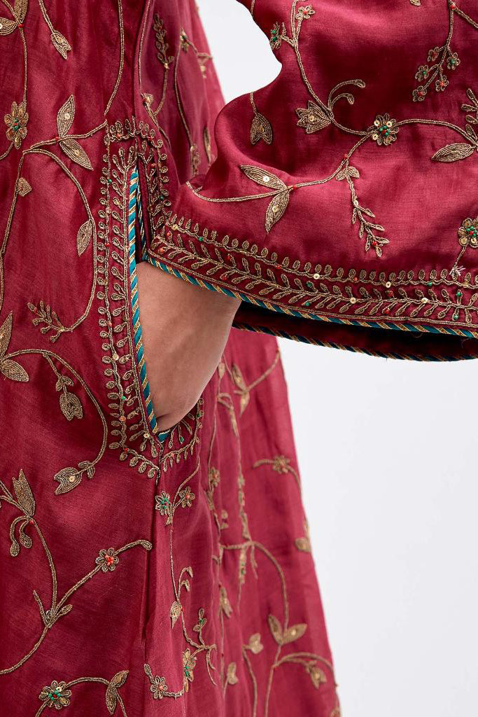 Red Silk Chanderi A-line short kurta set with all-over dull gold dori embroidery, highlighted with multi colored bead and gold sequins work.