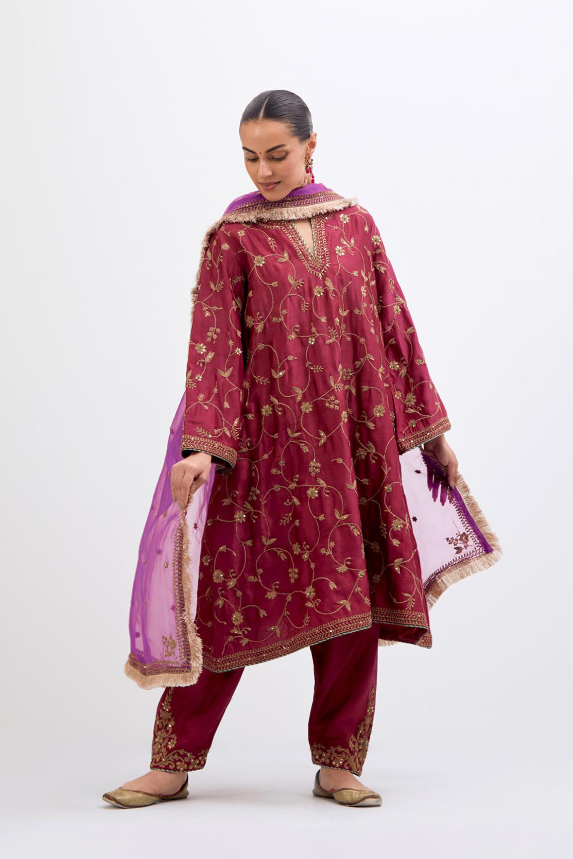 Red Silk Chanderi A-line short kurta set with all-over dull gold dori embroidery, highlighted with multi colored bead and gold sequins work.
