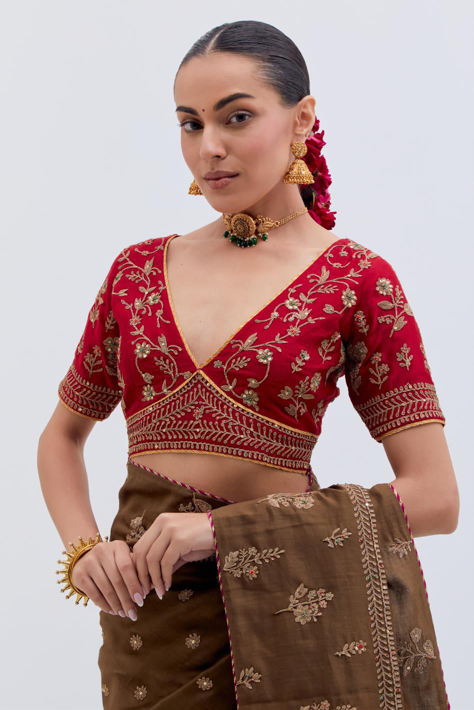 Olive Silk Chanderi saree with all-over dull gold dori embroidery, highlighted with multi colored beads and gold sequins, paired with Bright Red Silk Chanderi blouse with all-over dull gold dori embroidery.