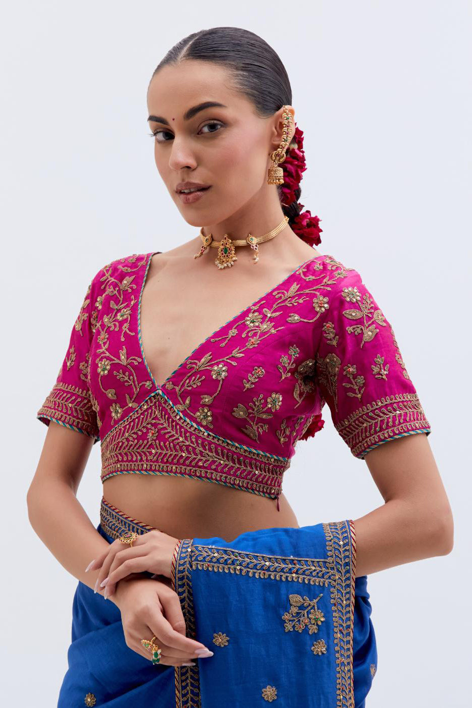 Chelsea Blue Silk Chanderi saree with all-over small floral dull gold dori booti embroidery, highlighted with multi colored beads and gold sequins work, paired with Fuchsia Silk Chanderi blouse with all-over dull gold dori embroidery.