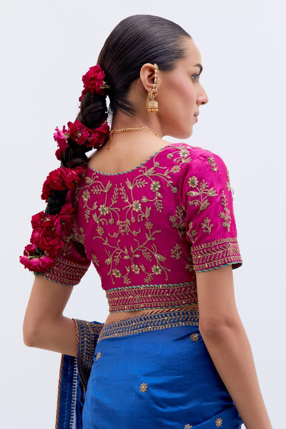 Chelsea Blue Silk Chanderi saree with all-over small floral dull gold dori booti embroidery, highlighted with multi colored beads and gold sequins work, paired with Fuchsia Silk Chanderi blouse with all-over dull gold dori embroidery.