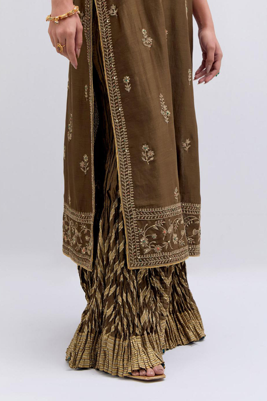 Olive Silk Chanderi straight kurta set with dull gold dori embroidery at front & back neck, sleeves, side slits and hem, highlighted with gold sequins and bead work.