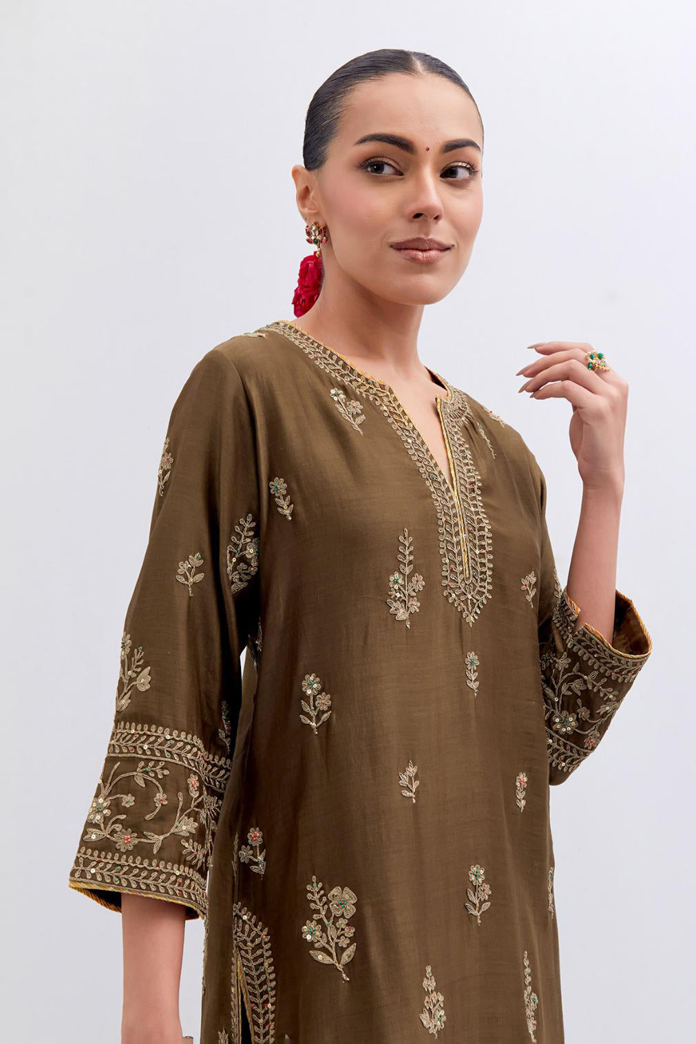 Olive Silk Chanderi straight kurta set with dull gold dori embroidery at front & back neck, sleeves, side slits and hem, highlighted with gold sequins and bead work.