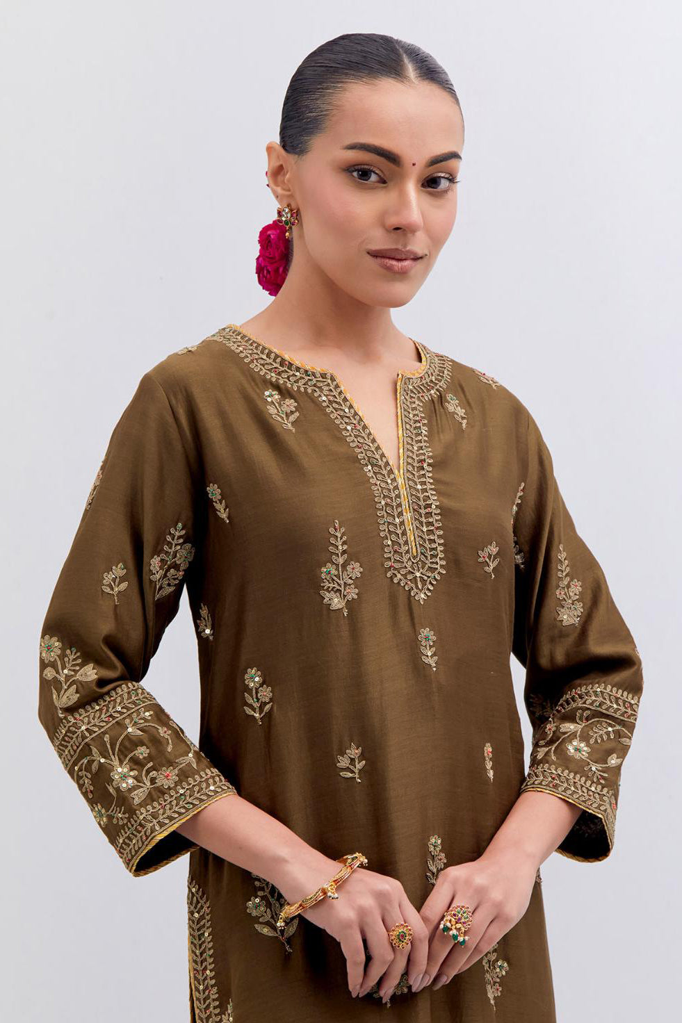 Olive Silk Chanderi straight kurta set with dull gold dori embroidery at front & back neck, sleeves, side slits and hem, highlighted with gold sequins and bead work.