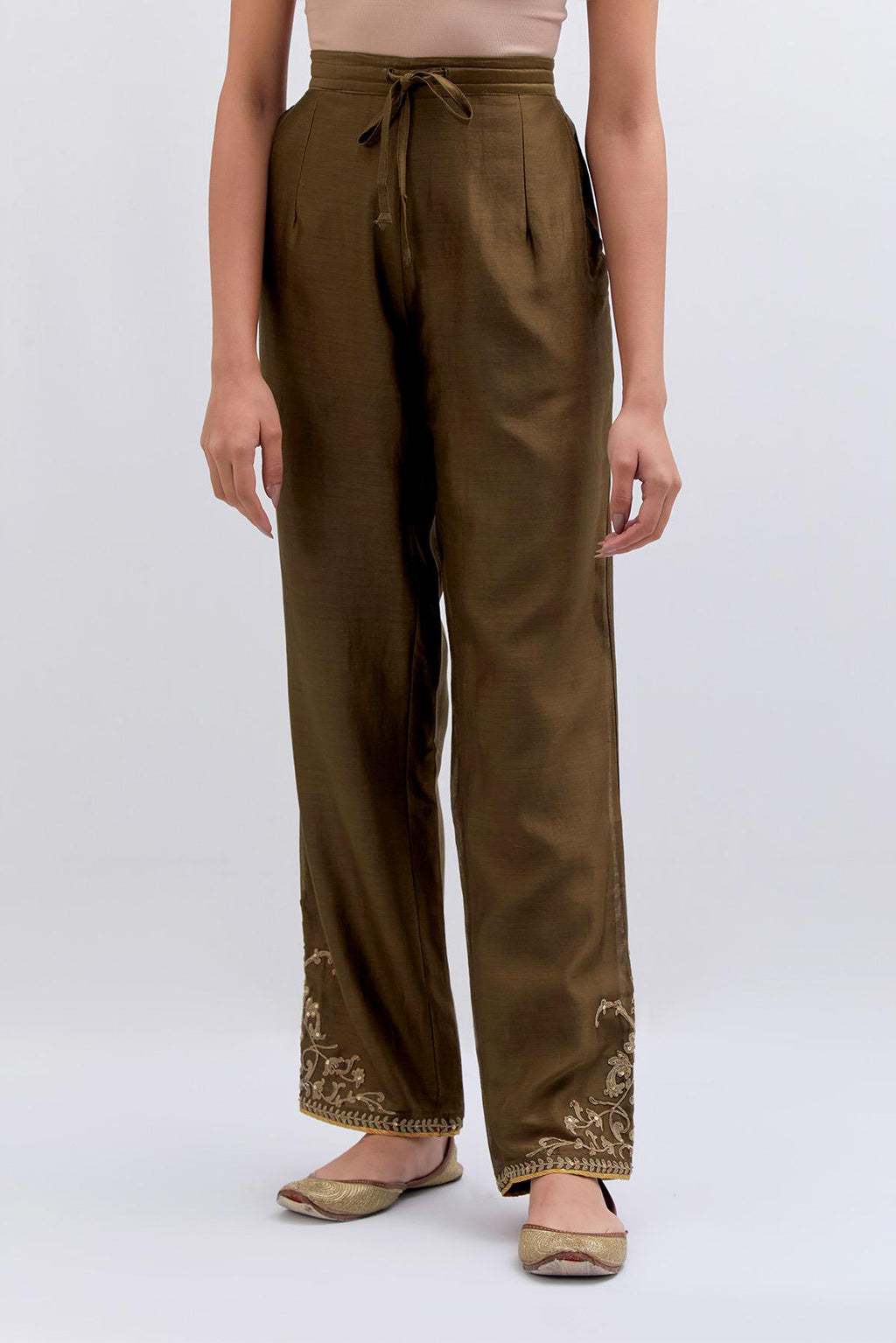 Olive Silk Chanderi pants with dull gold dori embroidery at hem, highlighted with multi colored beads and gold sequins work.