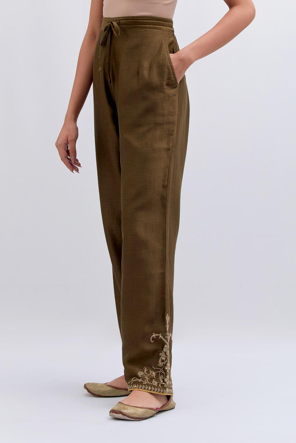 Olive Silk Chanderi pants with dull gold dori embroidery at hem, highlighted with multi colored beads and gold sequins work.