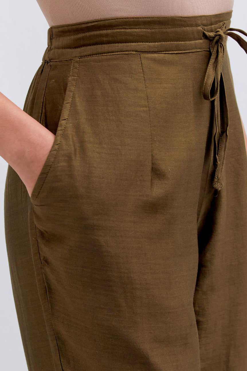 Olive Silk Chanderi pants with dull gold dori embroidery at hem, highlighted with multi colored beads and gold sequins work.