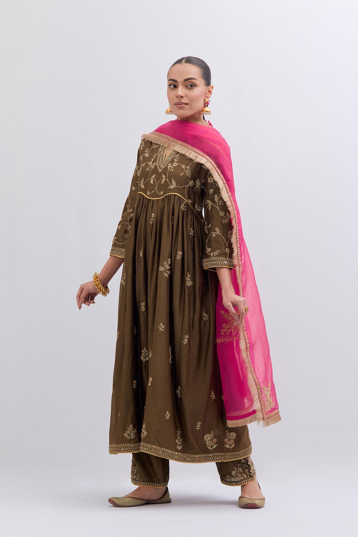 Olive Silk Chanderi long kurta dress set with all-over dull gold dori embroidery, highlighted with gold sequins and bead work.