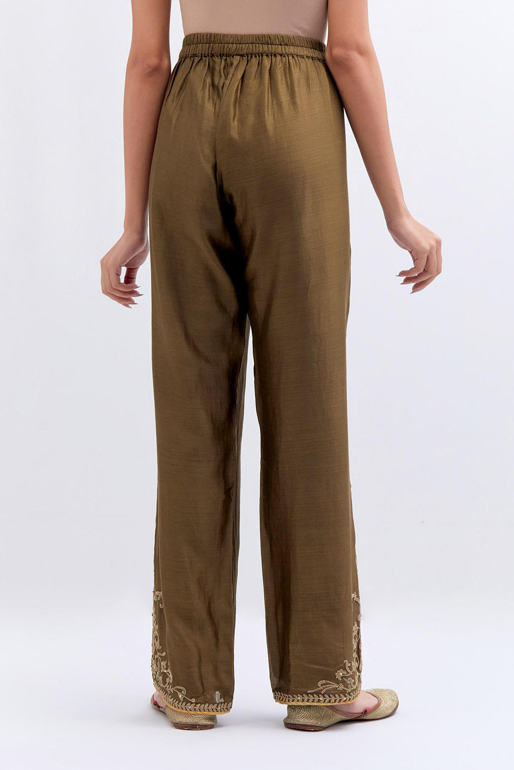 Olive Silk Chanderi pants with dull gold dori embroidery at hem, highlighted with multi colored beads and gold sequins work.