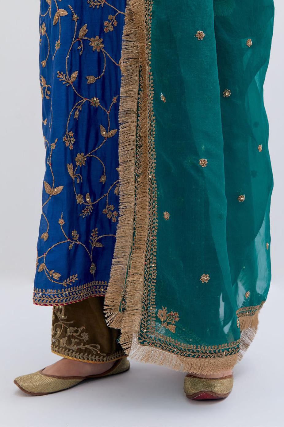 Teal Green Silk Organza dupatta detailed with all-over dull gold dori small floral booti embroidery, highlighted with multi colored beads and gold sequins work.