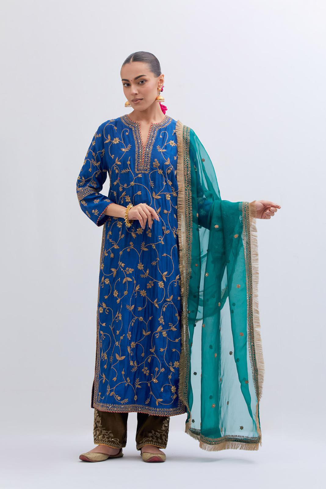 Teal Green Silk Organza dupatta detailed with all-over dull gold dori small floral booti embroidery, highlighted with multi colored beads and gold sequins work.