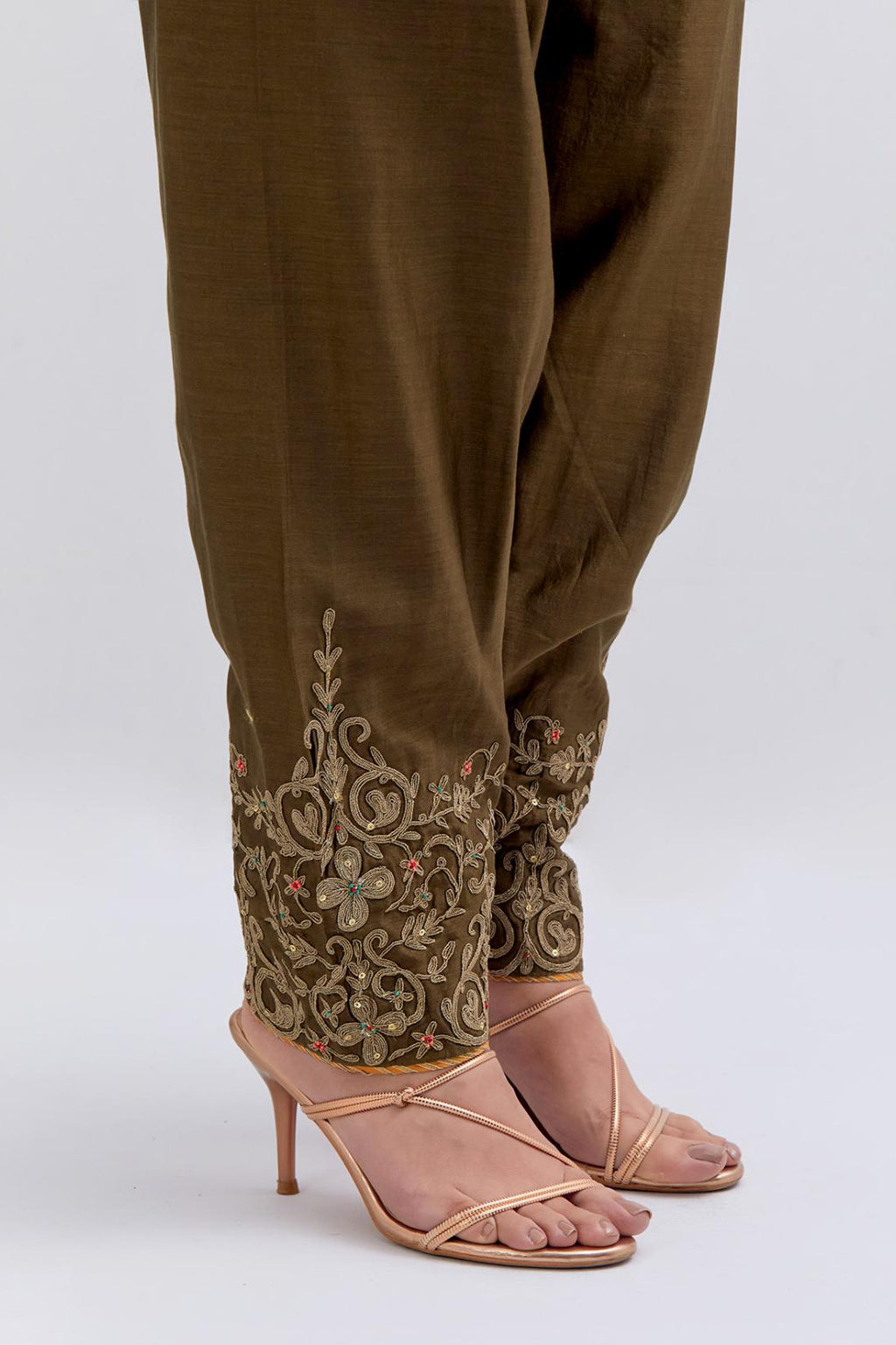 Olive Silk Chanderi narrow salwar with light gold dori embroidery at hem, highlighted with multi colored beads and gold sequins work.