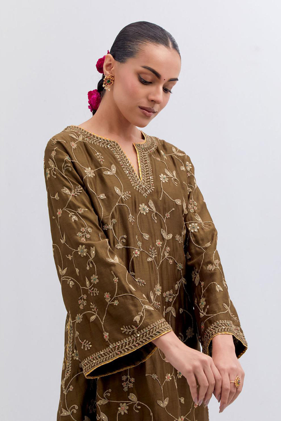 Olive Silk Chanderi A-line short kurta set with all-over dull gold dori embroidery, highlighted with multi colored bead and gold sequins work.