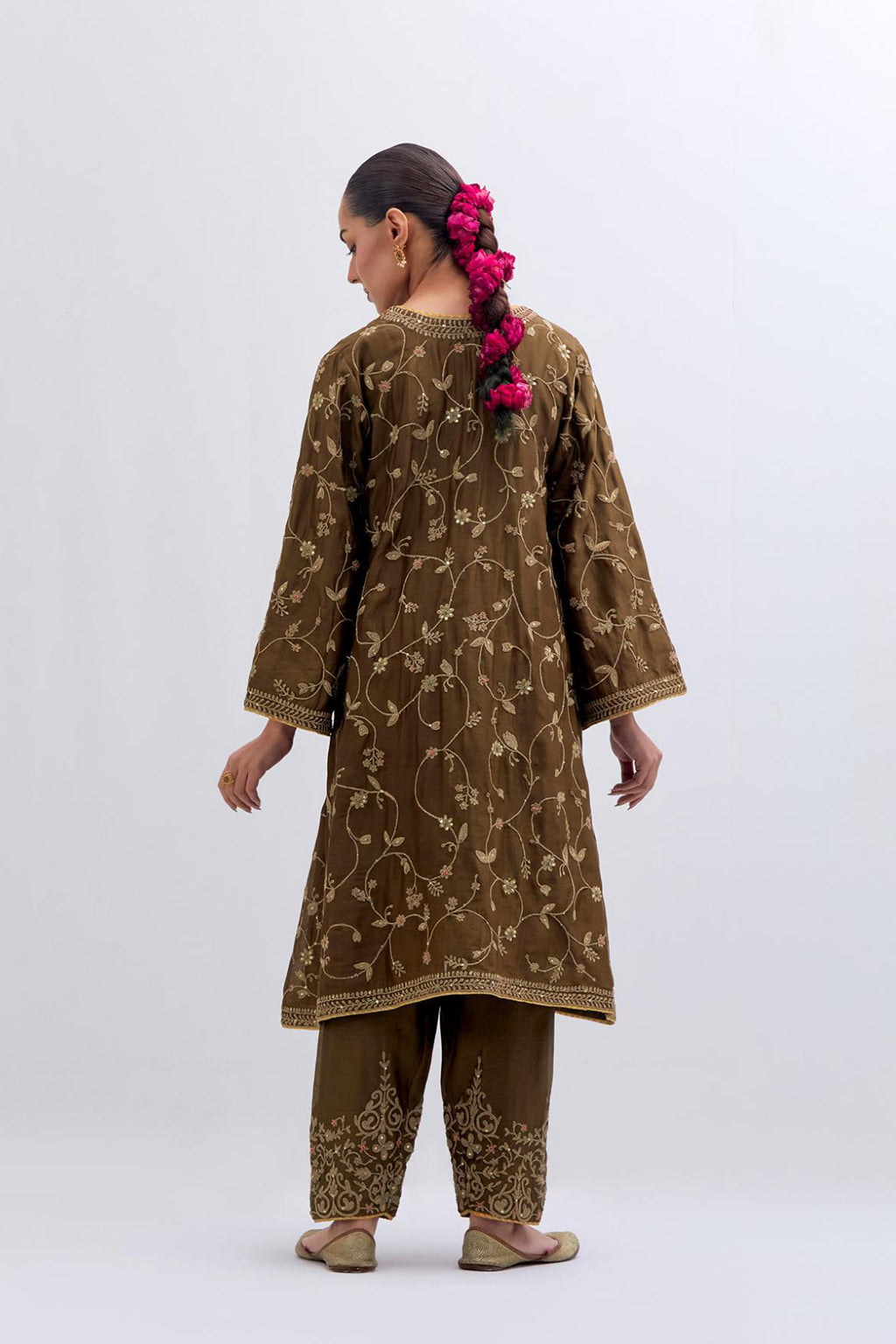 Olive Silk Chanderi A-line short kurta set with all-over dull gold dori embroidery, highlighted with multi colored bead and gold sequins work.