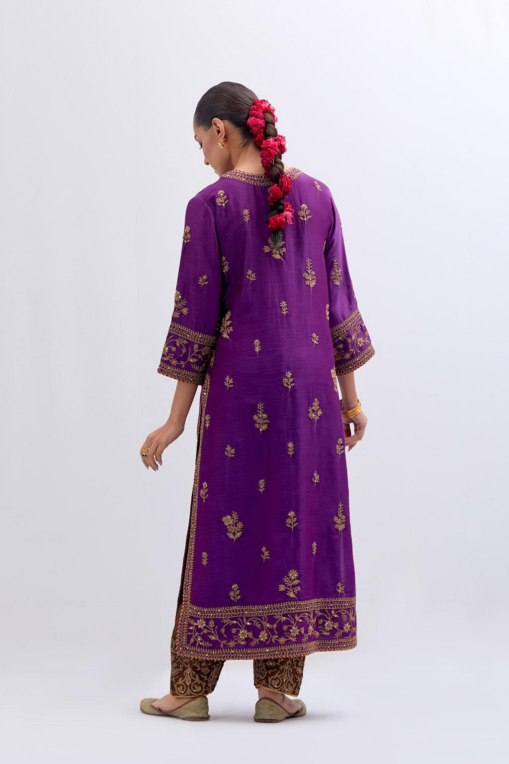 Purple Silk Chanderi straight kurta set with dull gold dori embroidery at front & back neck, sleeves, side slits and hem, highlighted with gold sequins and bead work.