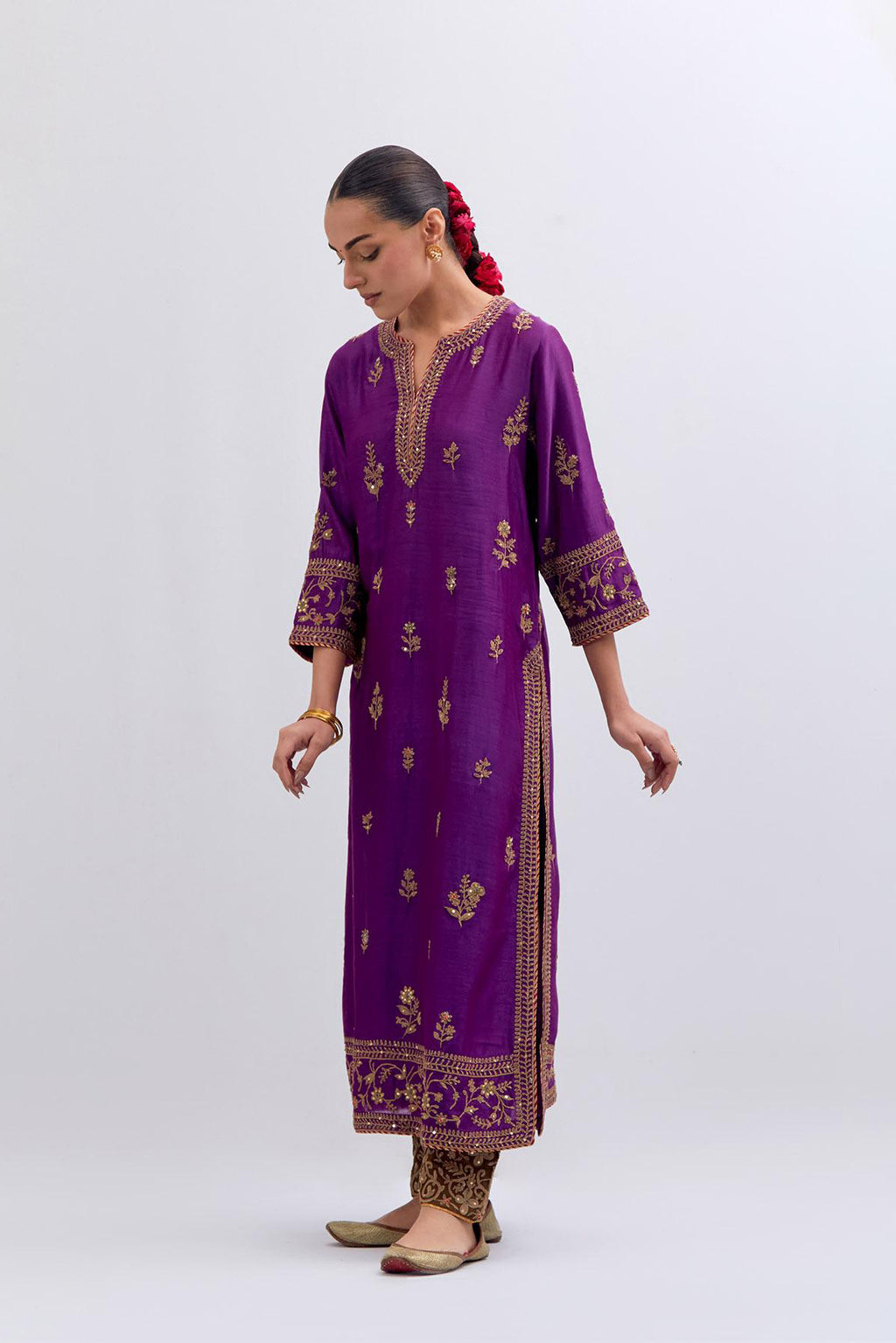Purple Silk Chanderi straight kurta set with dull gold dori embroidery at front & back neck, sleeves, side slits and hem, highlighted with gold sequins and bead work.