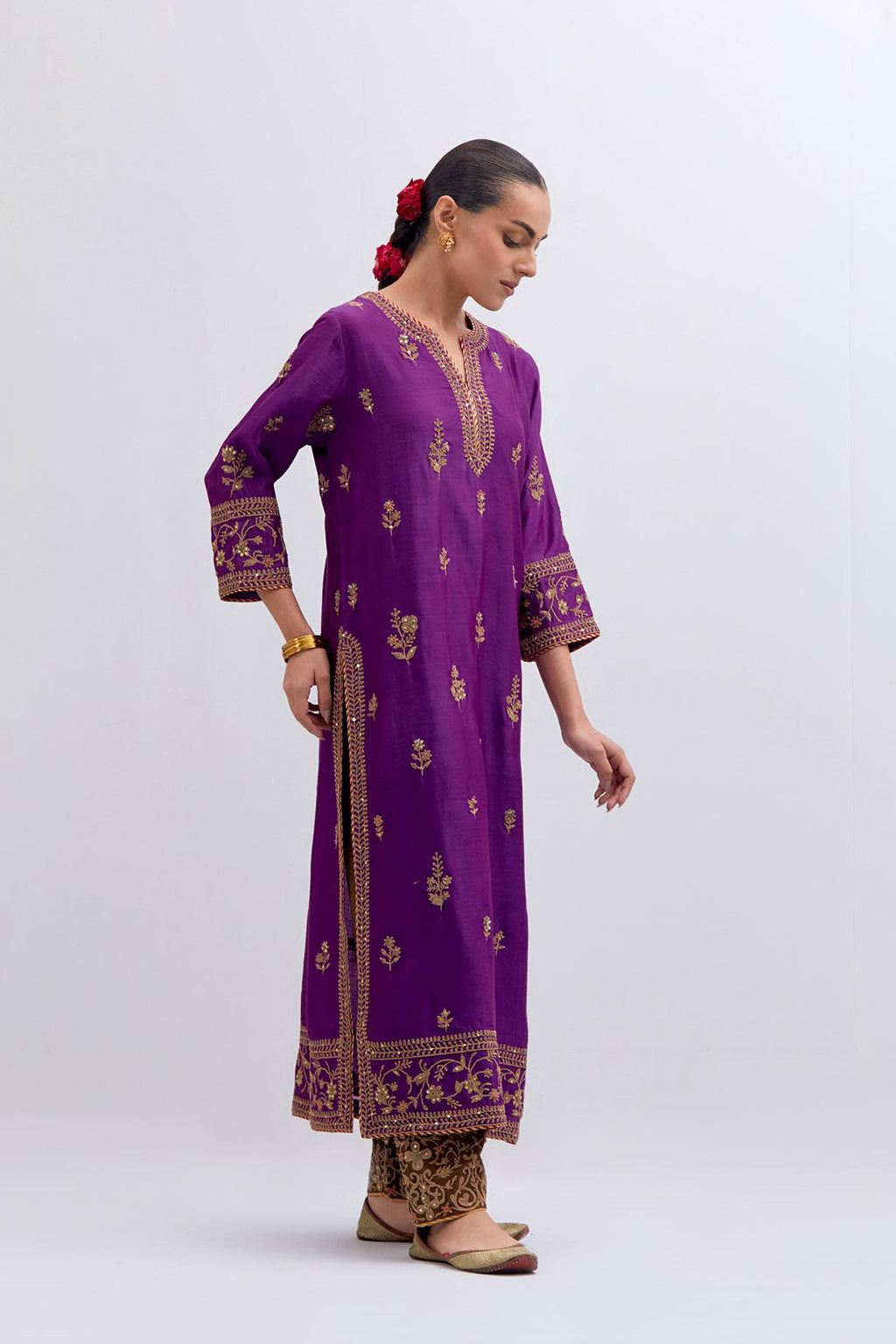 Purple Silk Chanderi straight kurta set with dull gold dori embroidery at front & back neck, sleeves, side slits and hem, highlighted with gold sequins and bead work.