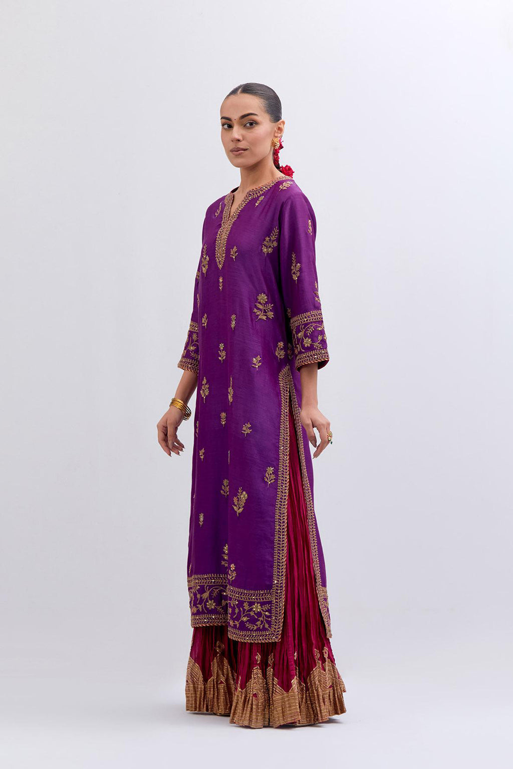 Purple Silk Chanderi straight kurta set with dull gold dori embroidery at front & back neck, sleeves, side slits and hem, highlighted with gold sequins and bead work.