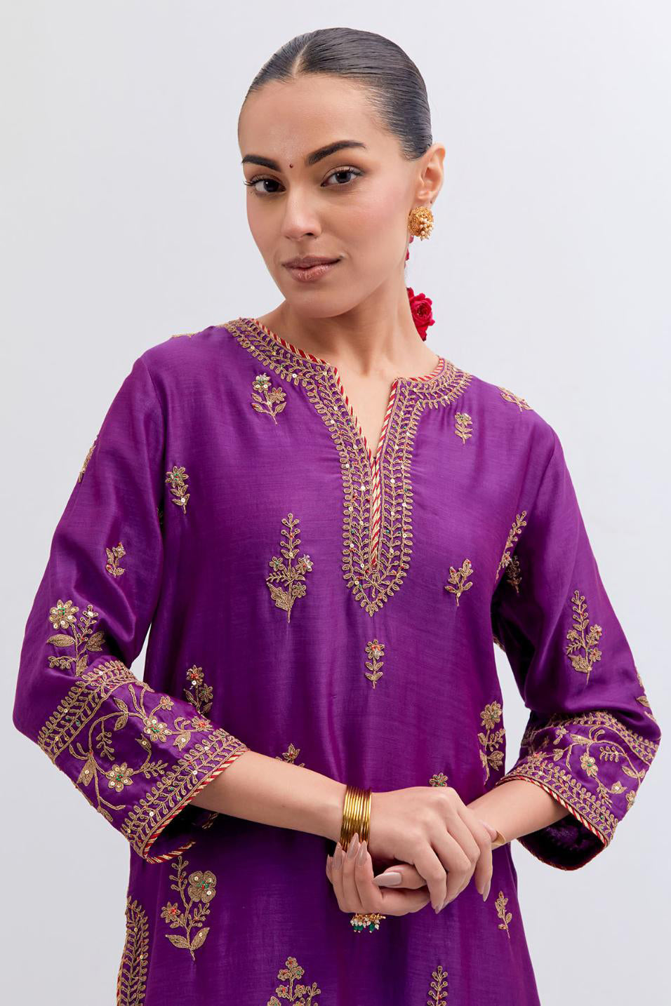 Purple Silk Chanderi straight kurta set with dull gold dori embroidery at front & back neck, sleeves, side slits and hem, highlighted with gold sequins and bead work.